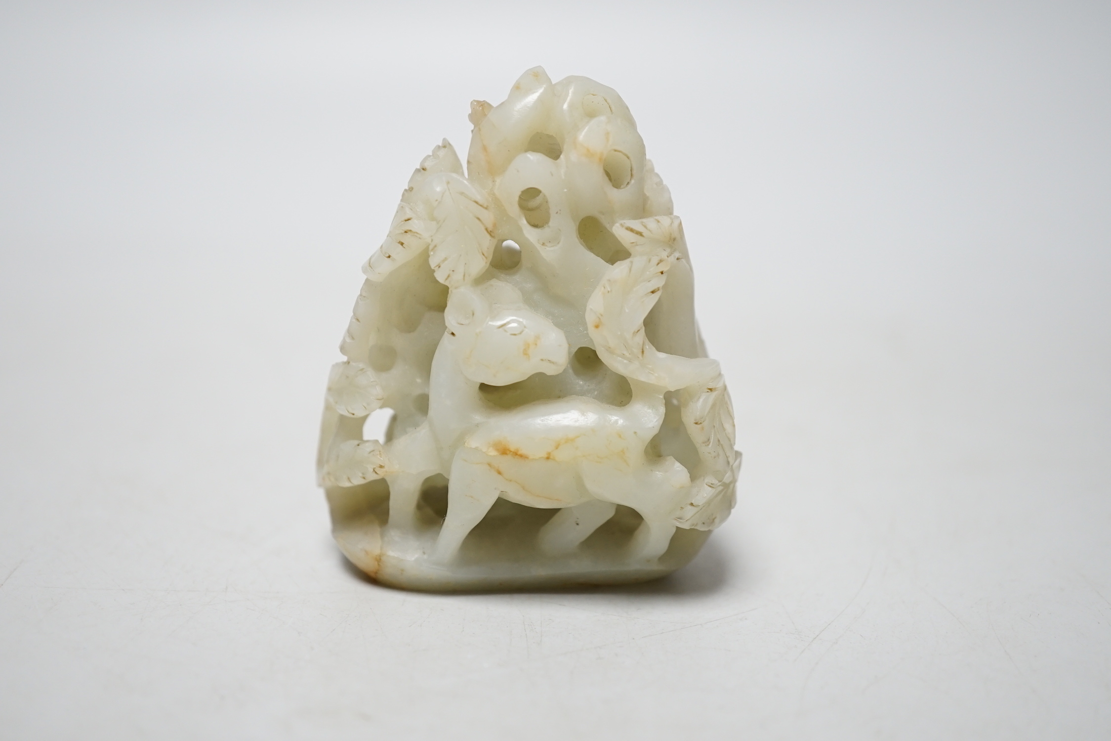 A Chinese pale celadon jade ‘deer’ carving, 7cm
